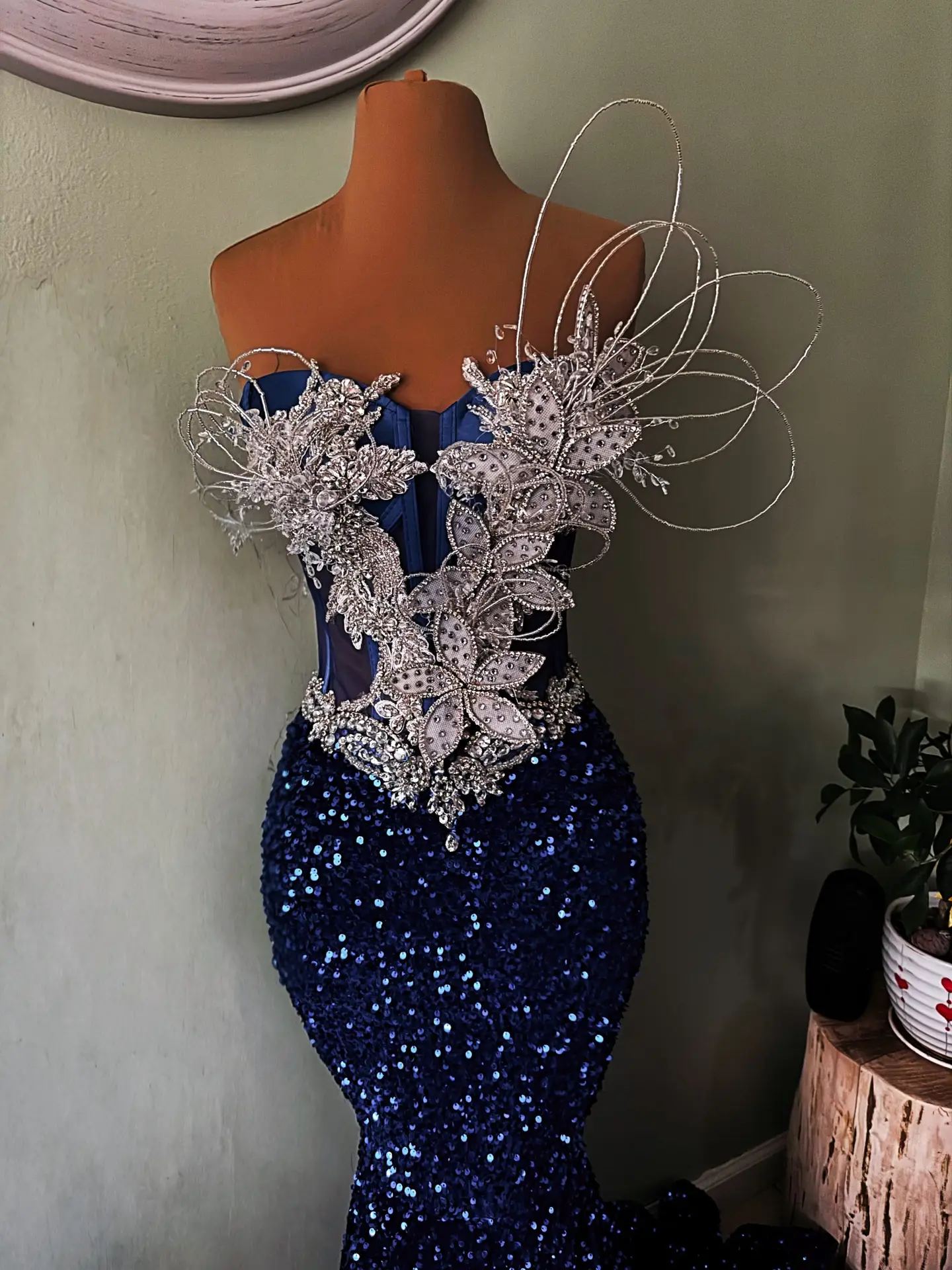 Intricate Hand-Beaded Embroidery: Features a blend of sequins and crystals.Contour-Enhancing Fit: Internal boning for a snatched waistline.Floor-Length Sweep Train: Adds a touch of regal drama to your entrance.Breathable Luxury Fabric: Fully lined with soft satin for a smooth feel against the skin.